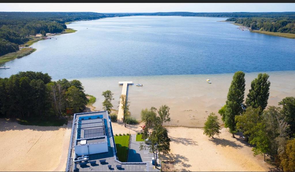 an aerial view of a beach next to a body of water at Aquarius Residence Apartament 104 in Boszkowo