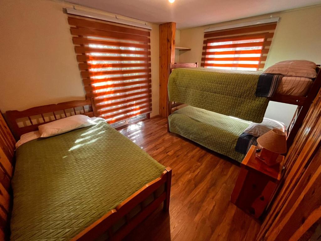 Postel nebo postele na pokoji v ubytování Ruka Pucón Hostel