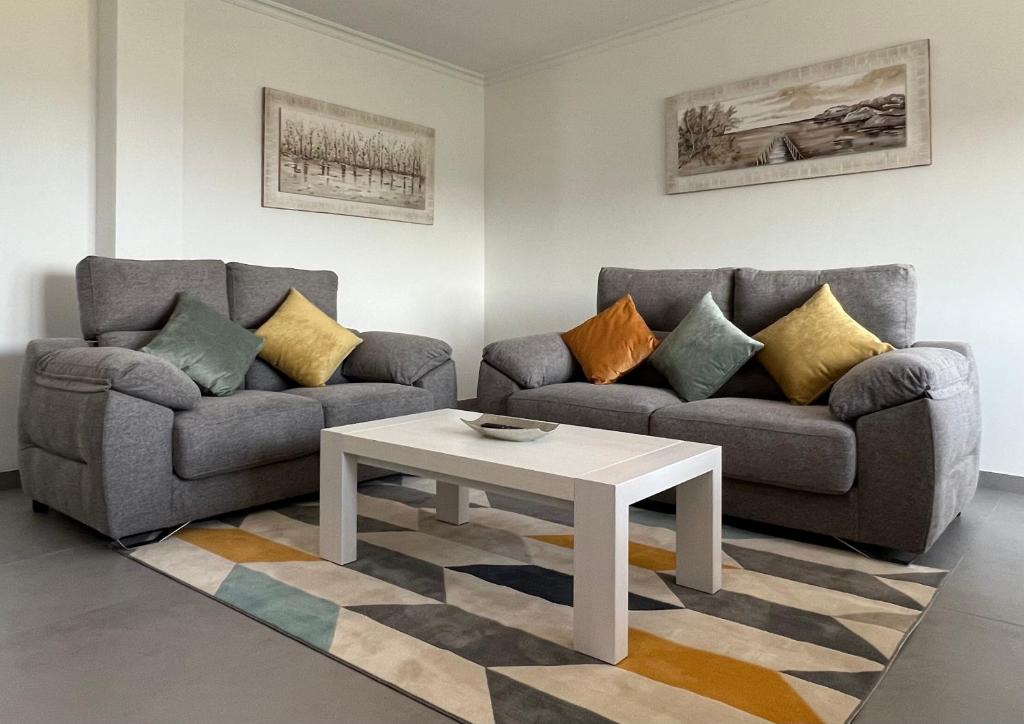 A seating area at Apartamentos Maria de Lucia- Ático