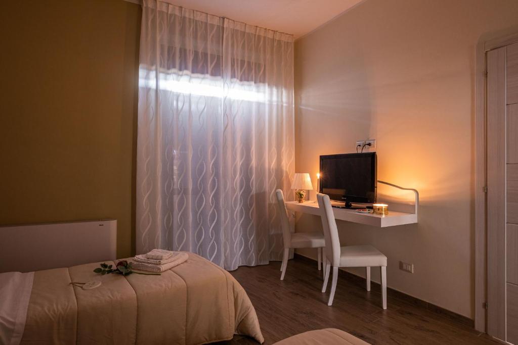 A bed or beds in a room at AGORA' Castelnuovo della Daunia