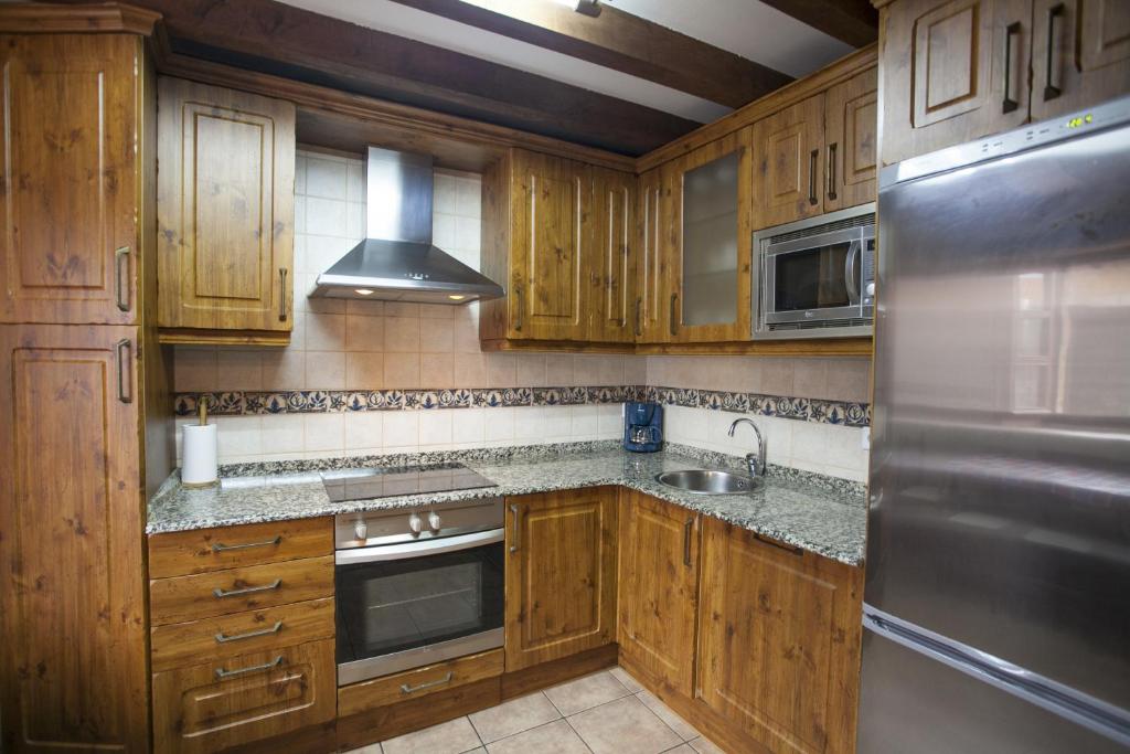 A kitchen or kitchenette at El Cabañon de Pimiango