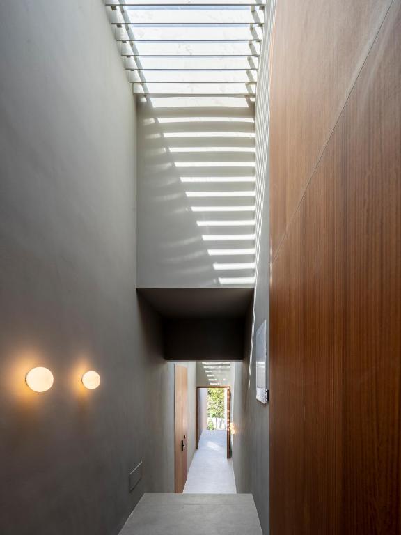 a hallway with a sloping ceiling with a skylight at INSUA BEACH HOUSE in Pontevedra