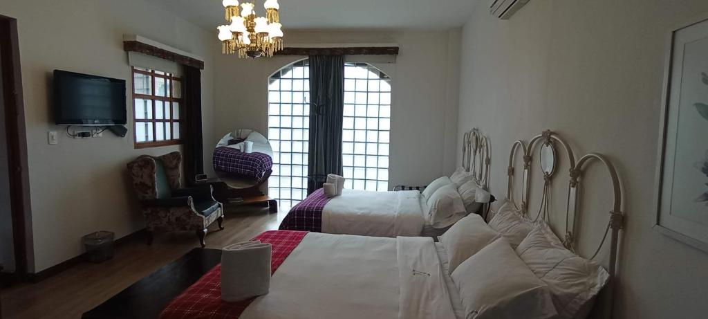 Postel nebo postele na pokoji v ubytování Hotel Don Alfonso