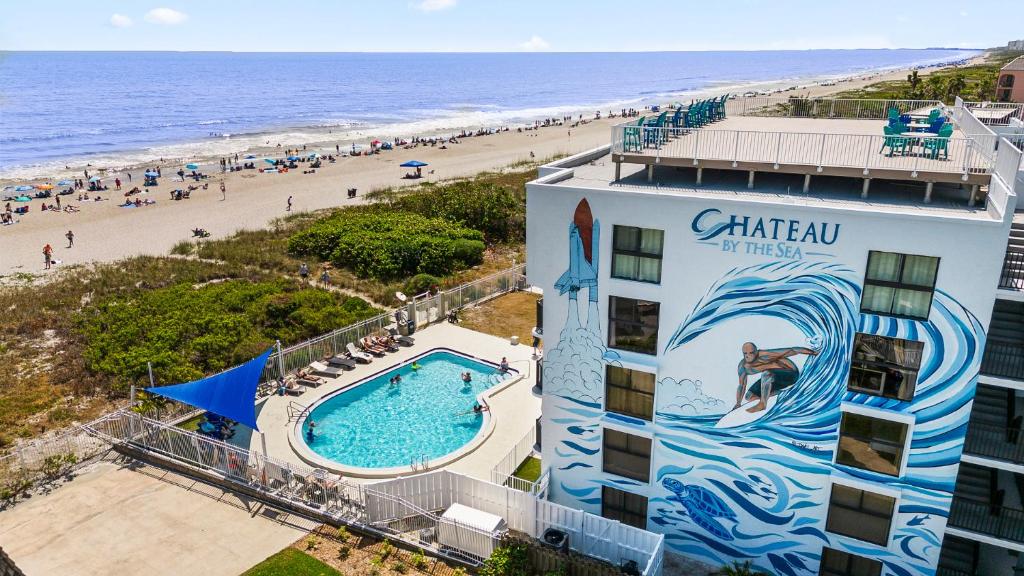 an aerial view of a hotel and the beach at Chateau by the Sea in Cocoa Beach