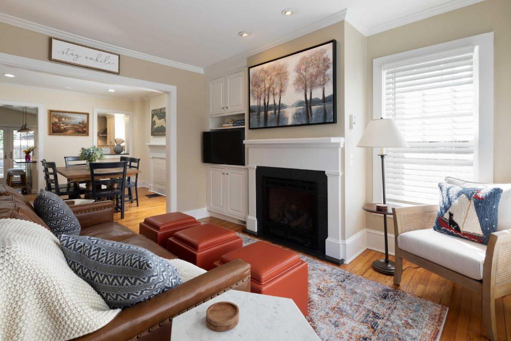 a living room with a couch and a fireplace at Charming Brooke House with Patio - In Town! in Lambertville