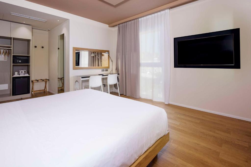 TV a/nebo společenská místnost v ubytování Best Western Plus Hotel Bologna