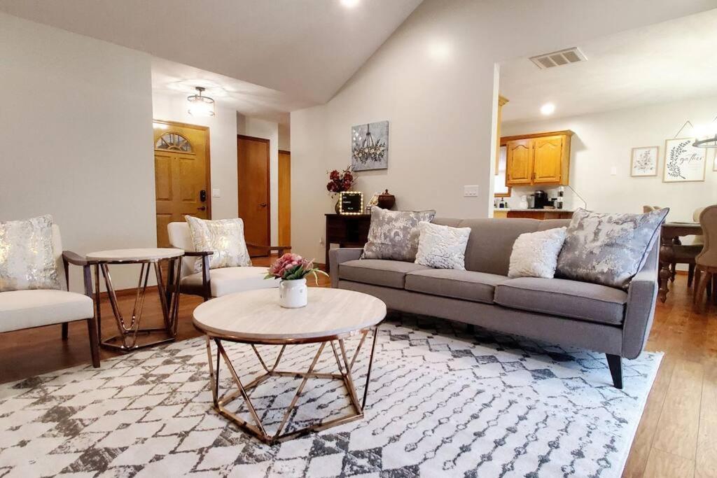 a living room with a couch and a table at Freshly Remodeled Quaint Home in Springfield