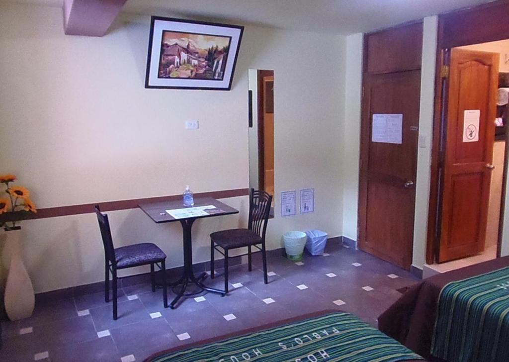 Postel nebo postele na pokoji v ubytování Hostal Pablo's House