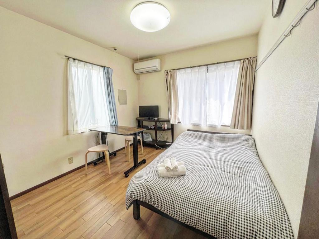 Giường trong phòng chung tại SHIBUYA HOUSE
