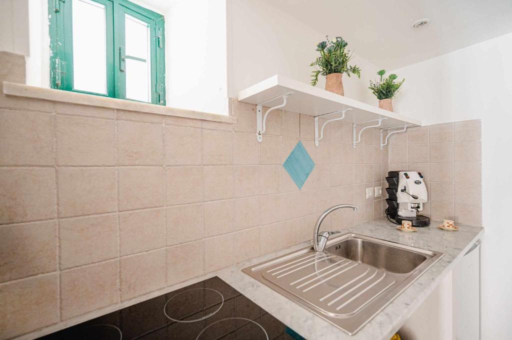 A kitchen or kitchenette at White Amalfi Centro Storico by ItalianHost