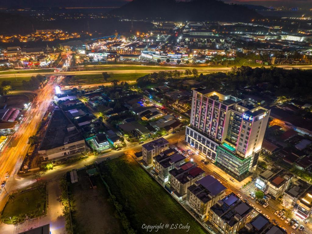 an aerial view of a city at night at Iconic Hotel in Bukit Mertajam