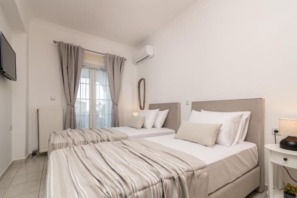 Postel nebo postele na pokoji v ubytování Swan Apartments