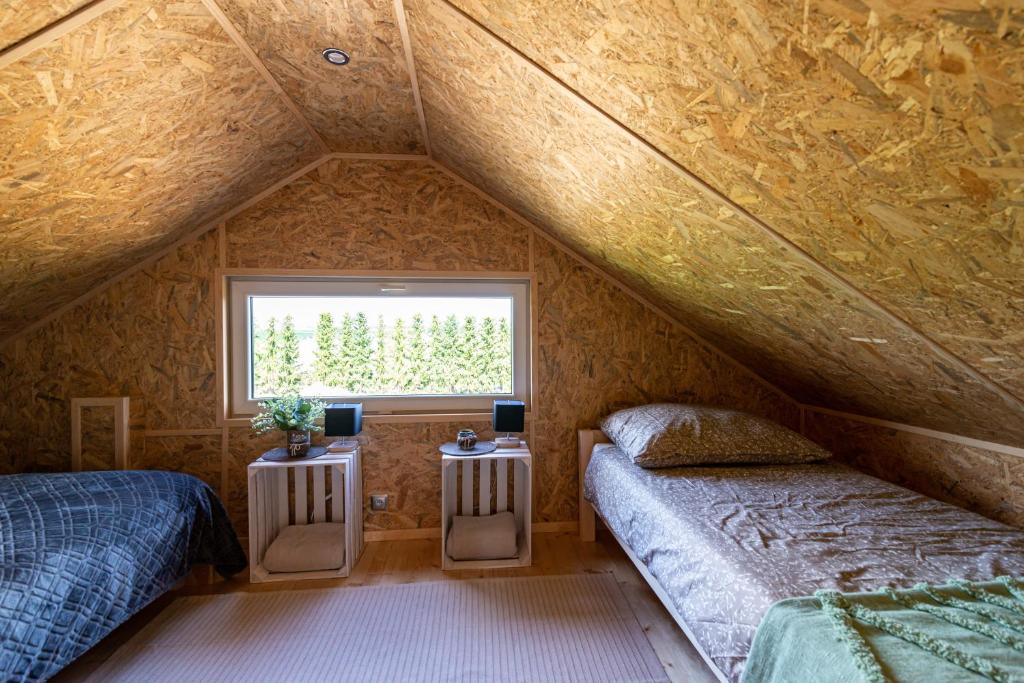 Postel nebo postele na pokoji v ubytování Apartamenty Leśne Zacisze