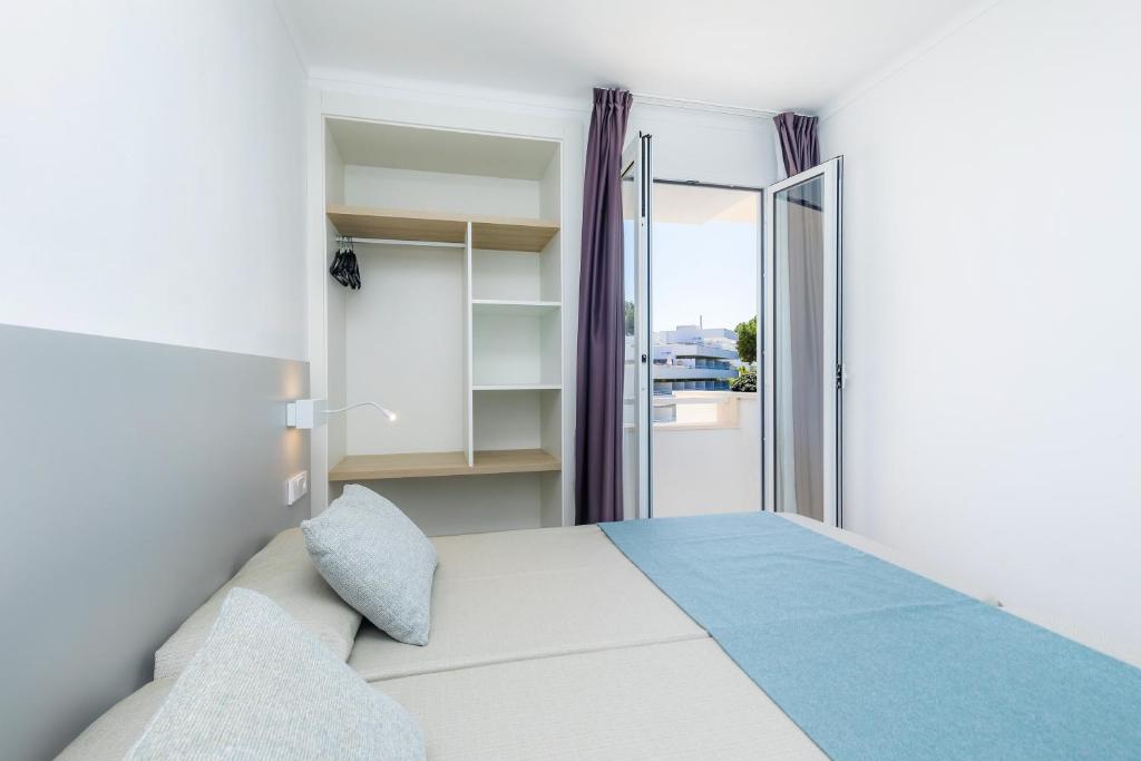 Posteľ alebo postele v izbe v ubytovaní Apartament Massanet 2b