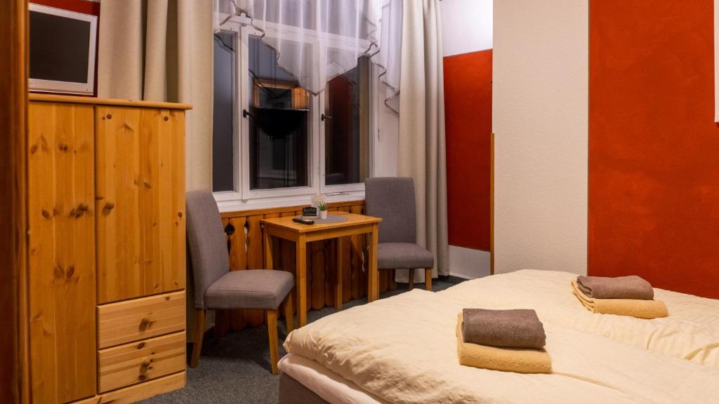 Postel nebo postele na pokoji v ubytování Pension Schrammsteinbaude