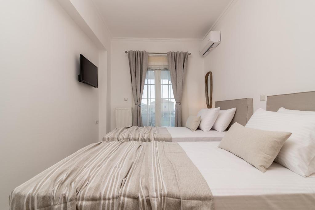 Postel nebo postele na pokoji v ubytování Swan Apartments