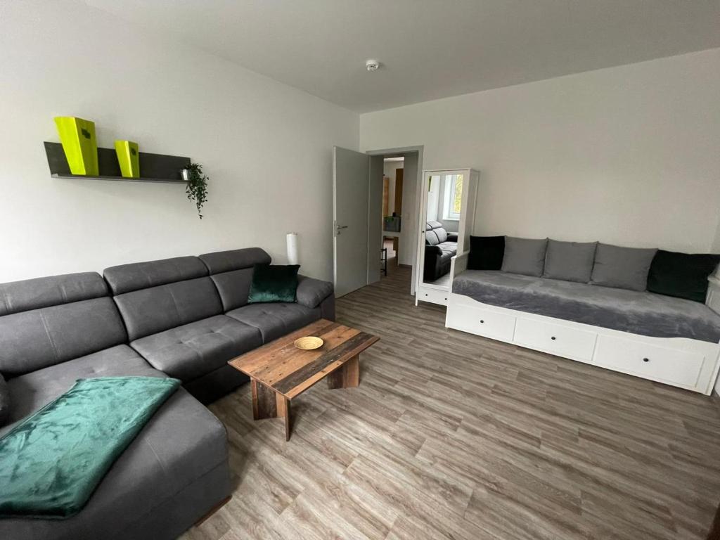 a living room with a couch and a coffee table at Ferienwohnung Kolow GbR in Angermünde