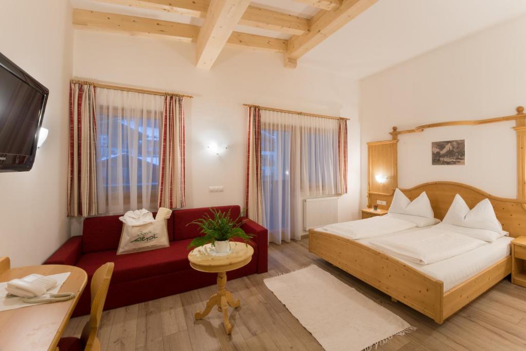 Postel nebo postele na pokoji v ubytování Biovita Hotel Alpi