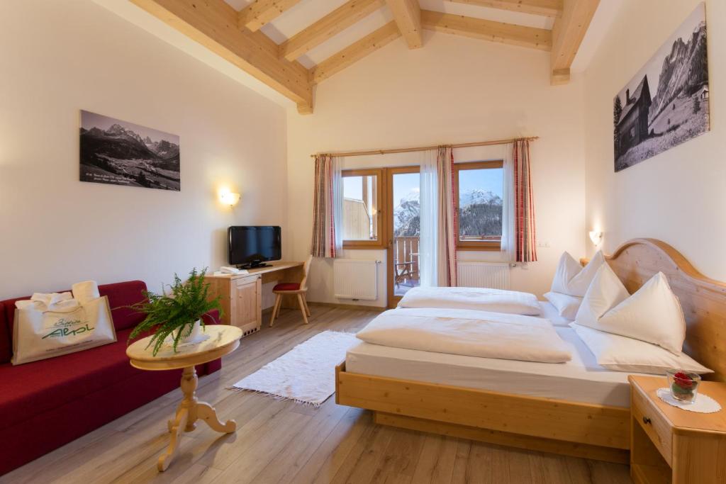 Postel nebo postele na pokoji v ubytování Biovita Hotel Alpi