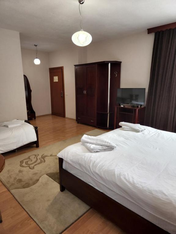 Postel nebo postele na pokoji v ubytování Guesthouse Bimbli
