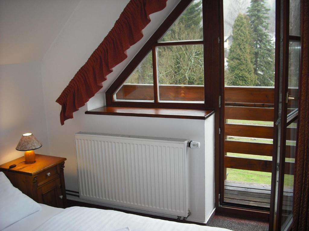Łóżko lub łóżka w pokoju w obiekcie Sport hotel POMI