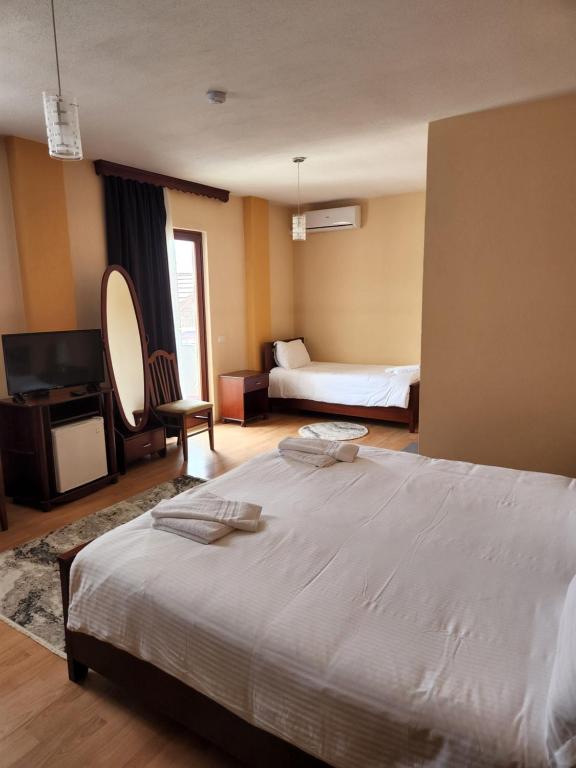 Postel nebo postele na pokoji v ubytování Guesthouse Bimbli