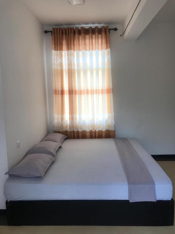 Postel nebo postele na pokoji v ubytování Hotel Ganthera Kataragama