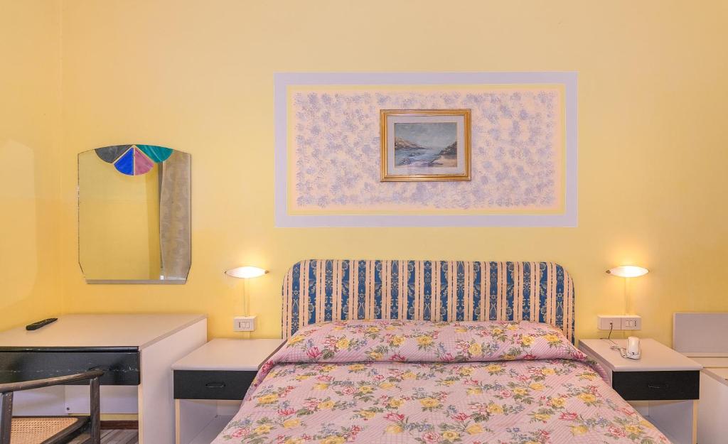 Postel nebo postele na pokoji v ubytování Hotel Stella Del Mare