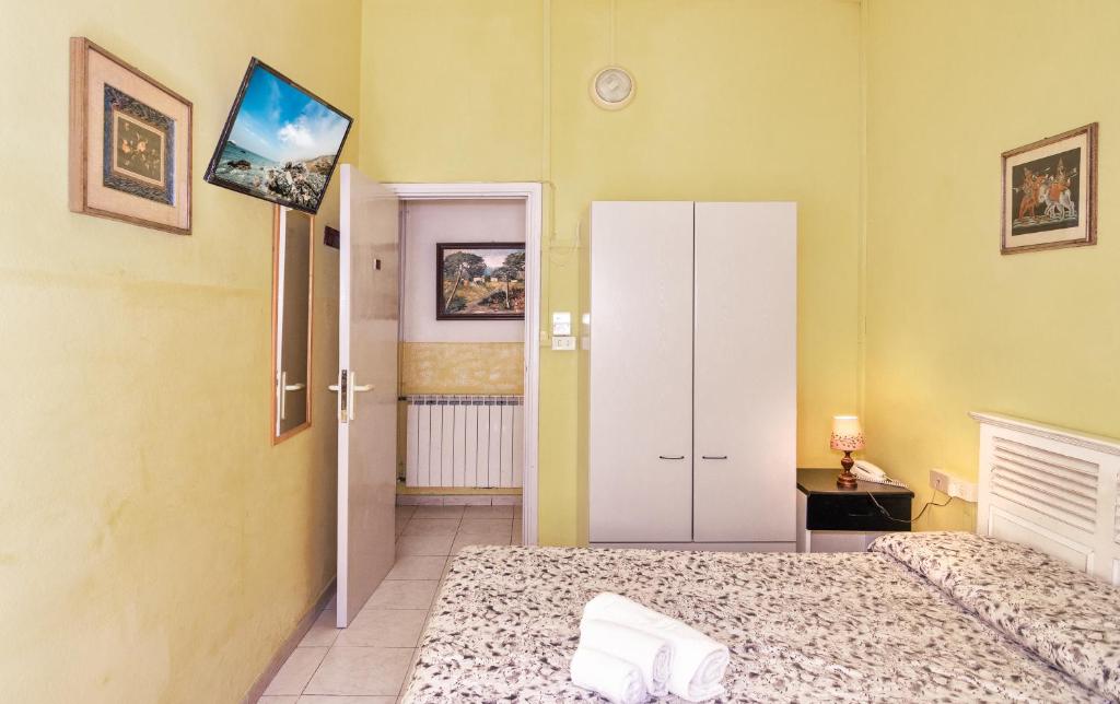 Postel nebo postele na pokoji v ubytování Hotel Stella Del Mare