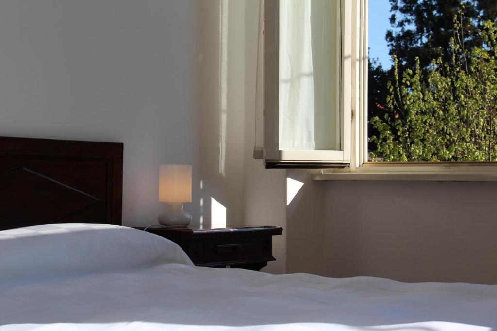 Posteľ alebo postele v izbe v ubytovaní Albergo Bologna