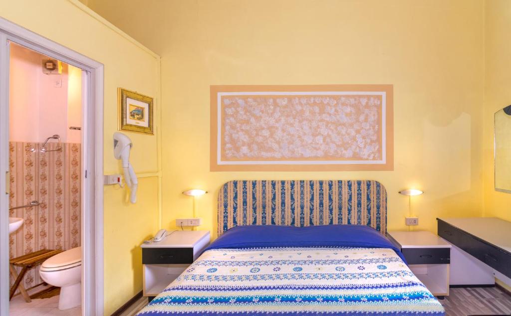 Postel nebo postele na pokoji v ubytování Hotel Stella Del Mare
