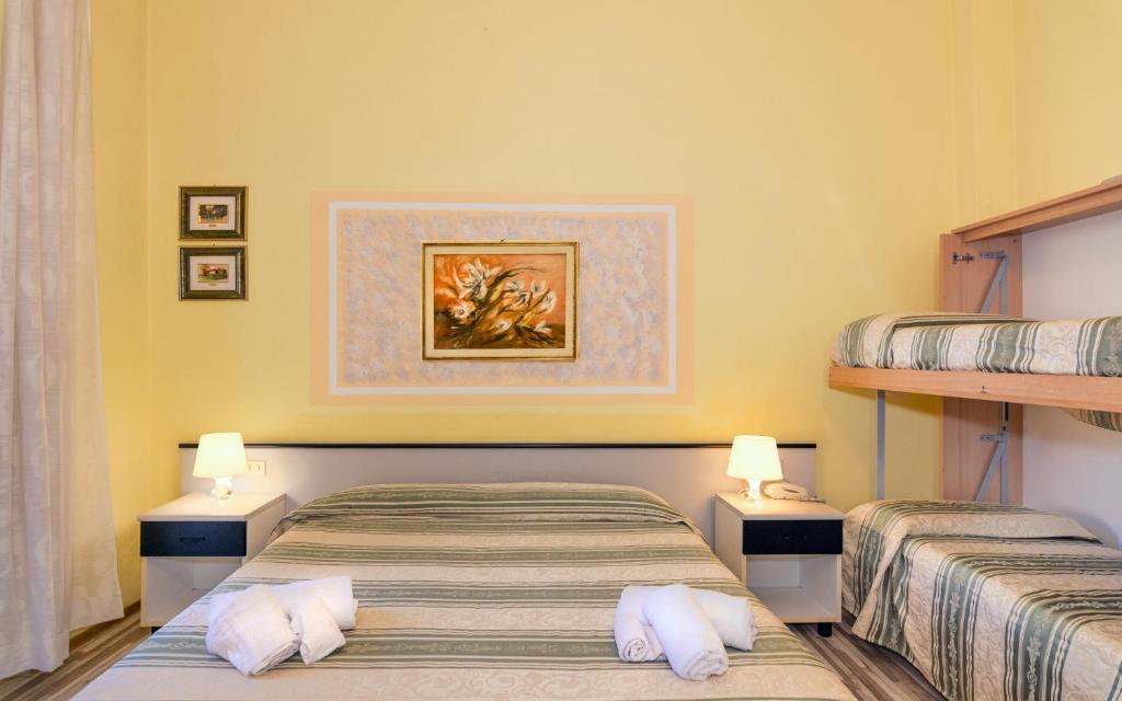 Postel nebo postele na pokoji v ubytování Hotel Stella Del Mare