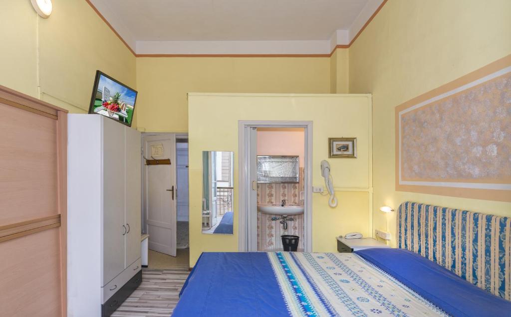 Postel nebo postele na pokoji v ubytování Hotel Stella Del Mare
