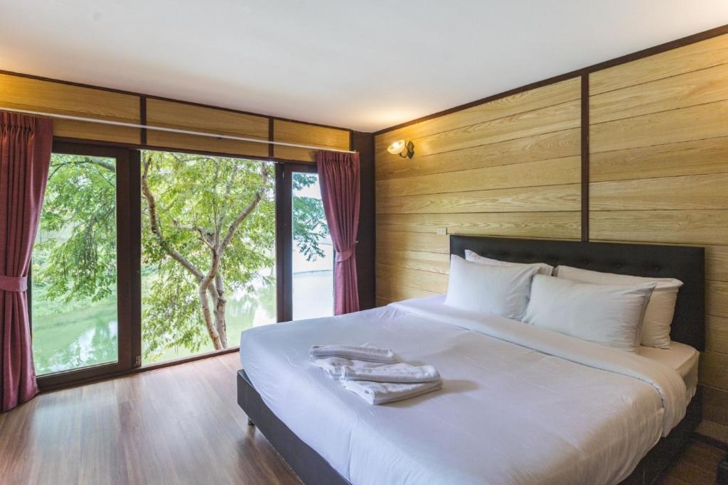 Postel nebo postele na pokoji v ubytování Ruknam Resort