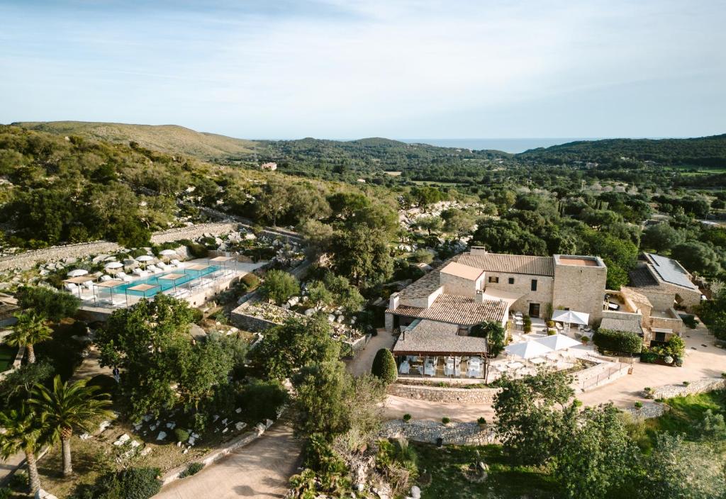 an aerial view of a resort with a pool at Cases de Son Barbassa Hotel & Restaurant in Capdepera