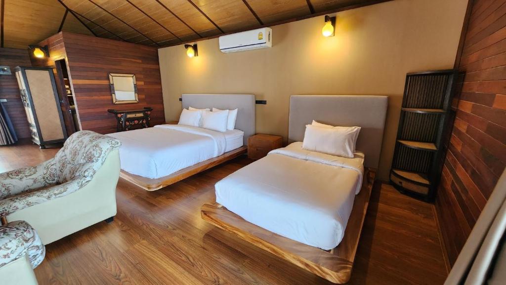 Postel nebo postele na pokoji v ubytování Ruknam Resort