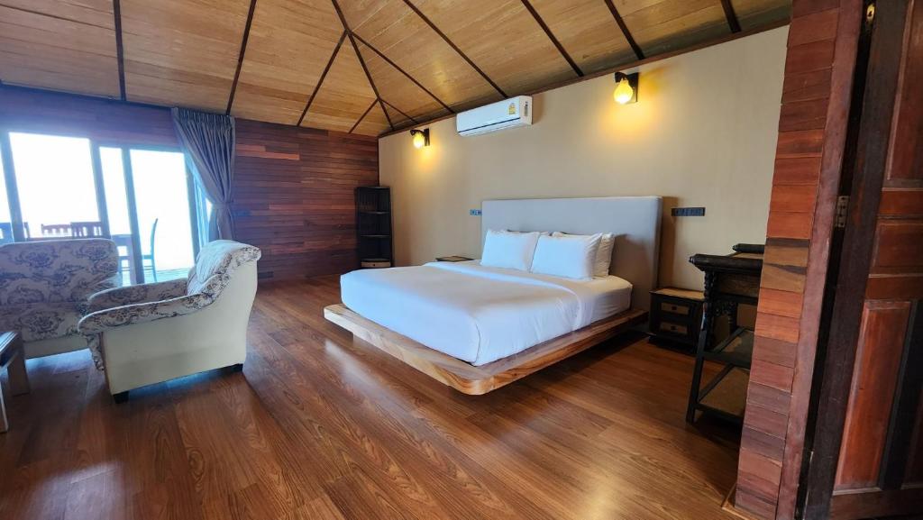 Postel nebo postele na pokoji v ubytování Ruknam Resort