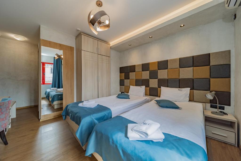 Postel nebo postele na pokoji v ubytování Hotel Garni VIZURA Sport
