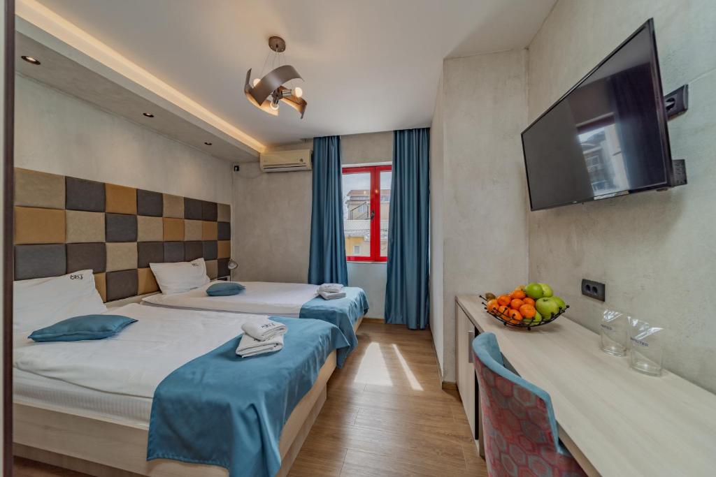 Postel nebo postele na pokoji v ubytování Hotel Garni VIZURA Sport