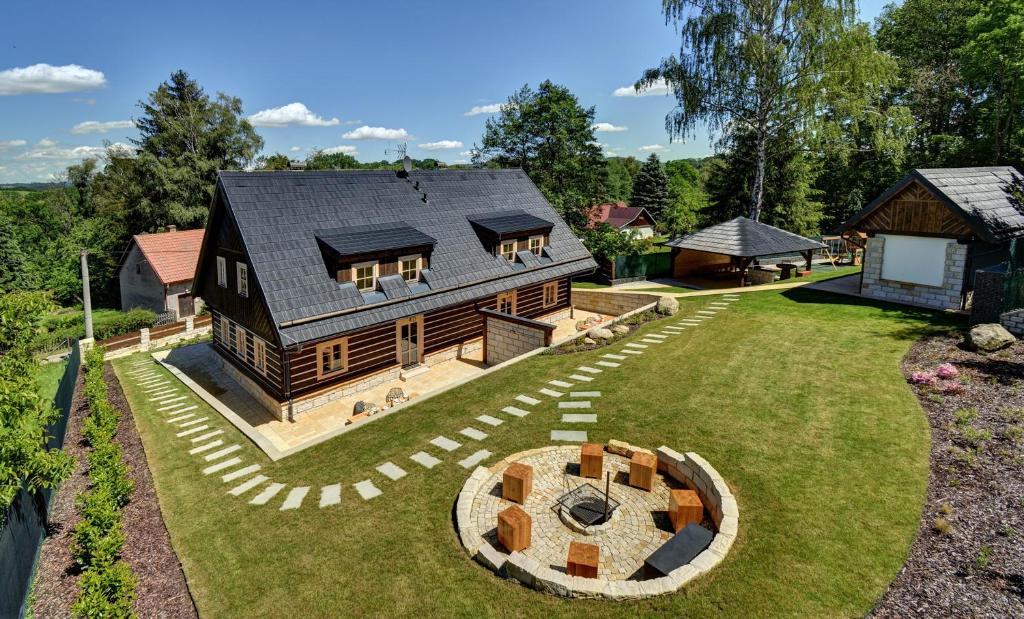 an aerial view of a house with a backyard at Roubenka pod Troskami in Ktová