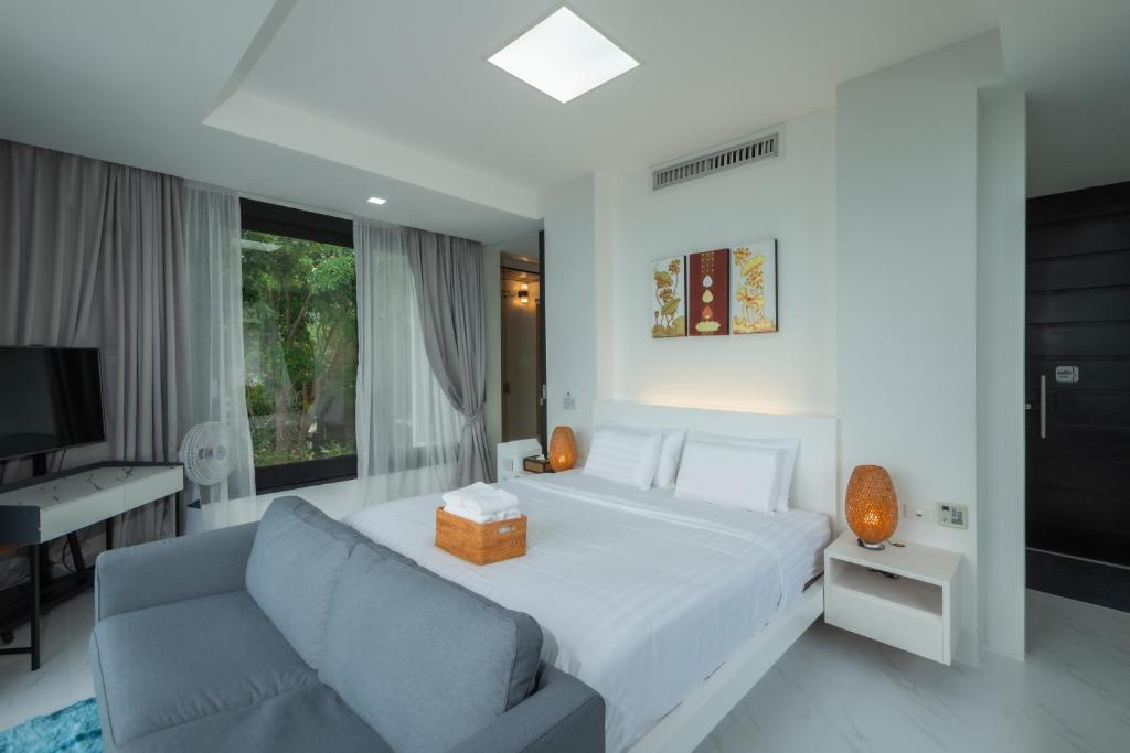Postel nebo postele na pokoji v ubytování Bluemango Pool Villa & Resort Koh Samui