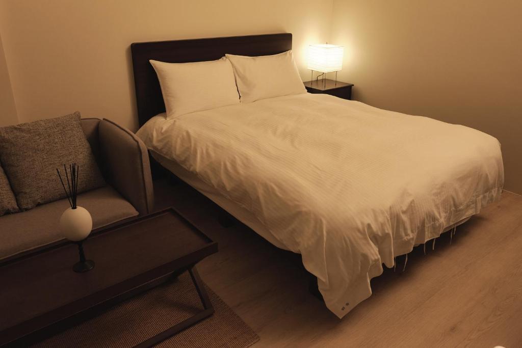 Postel nebo postele na pokoji v ubytování Yueshe House