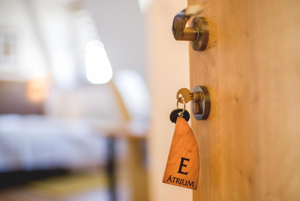 Postel nebo postele na pokoji v ubytování Penzión ÁTRIUM