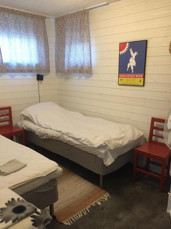 Postel nebo postele na pokoji v ubytování Ateljen