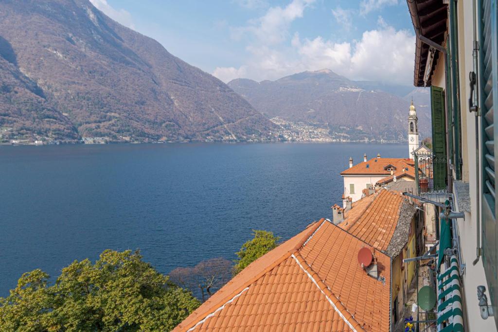a view of the water from a building at Bright apartment in Nesso with Lake view! in Nesso