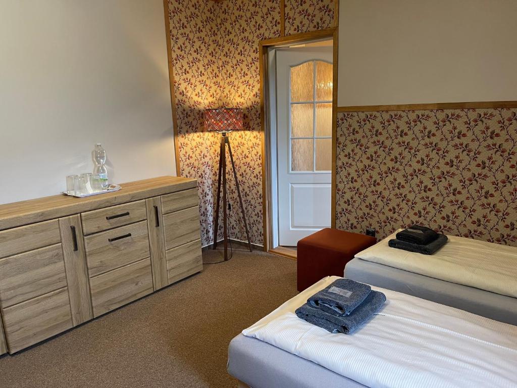 Postel nebo postele na pokoji v ubytování Hotel Veveří