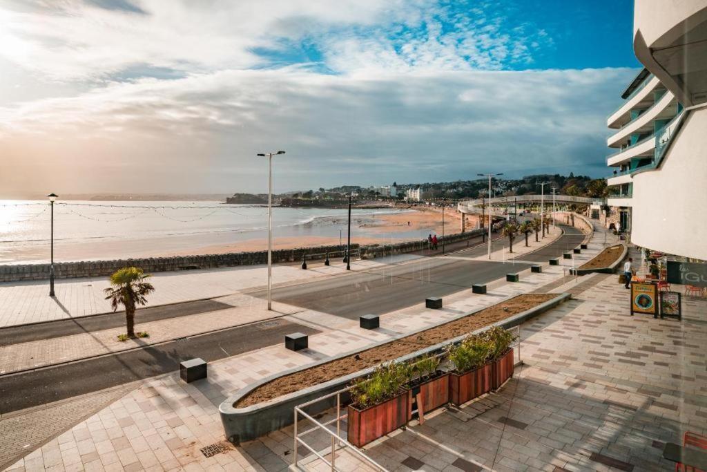 a view of the beach from a building at Sandybanks Torquay - Seaview and Promenade Apartments in Torquay