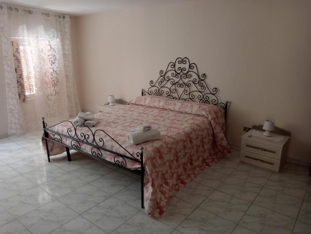 Кровать или кровати в номере Casa Agatina