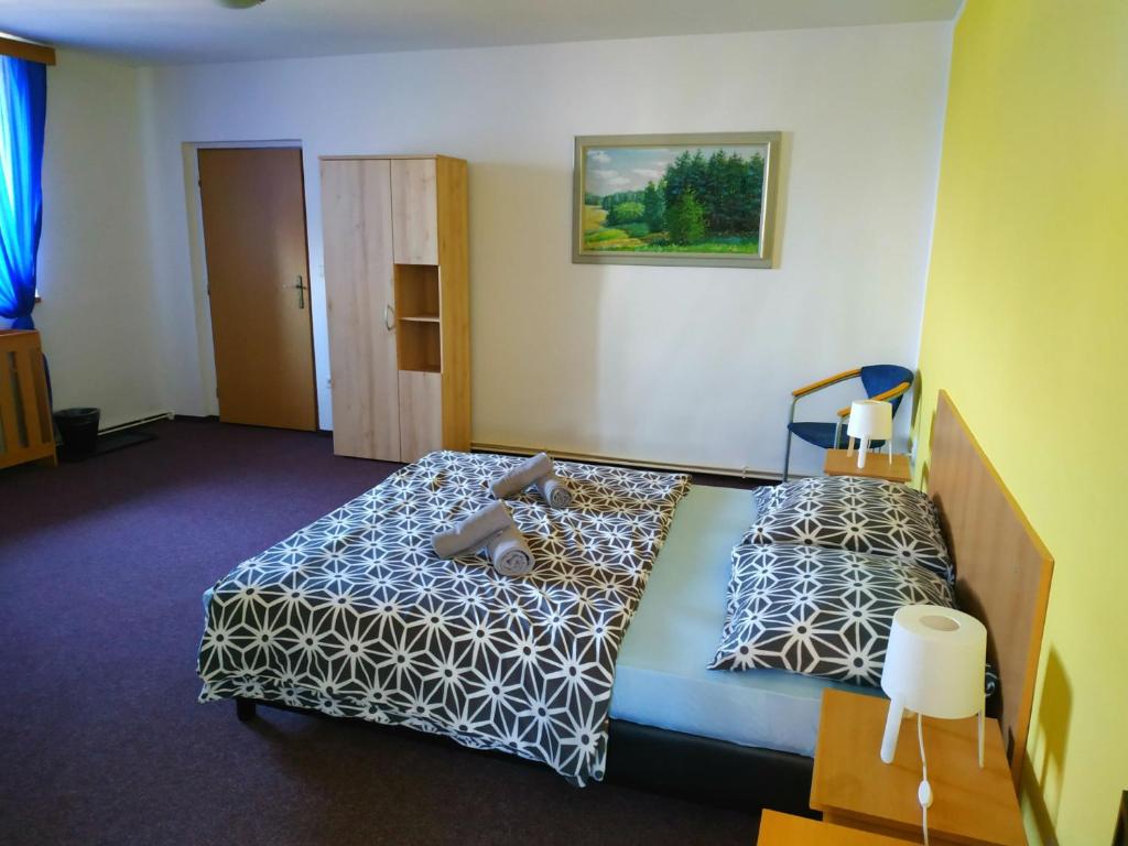 Postel nebo postele na pokoji v ubytování Hotel Vyhlídka