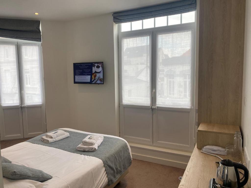 Postel nebo postele na pokoji v ubytování Hôtel Villa Des 2 Caps